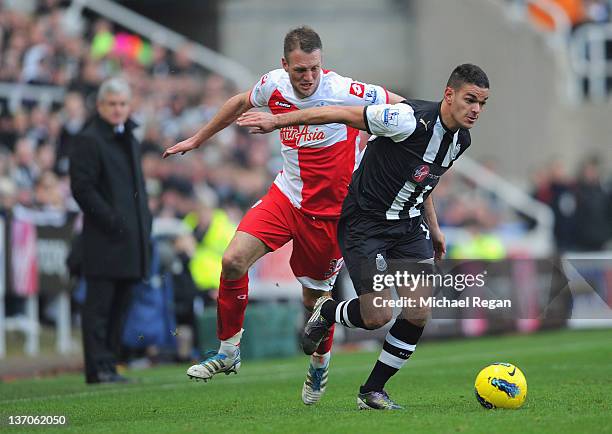 Clint Hill of QPR in action with Hatem Ben Arfa of Newcastle during the Barclays Premier League match between Newcastle United and Queens Park...