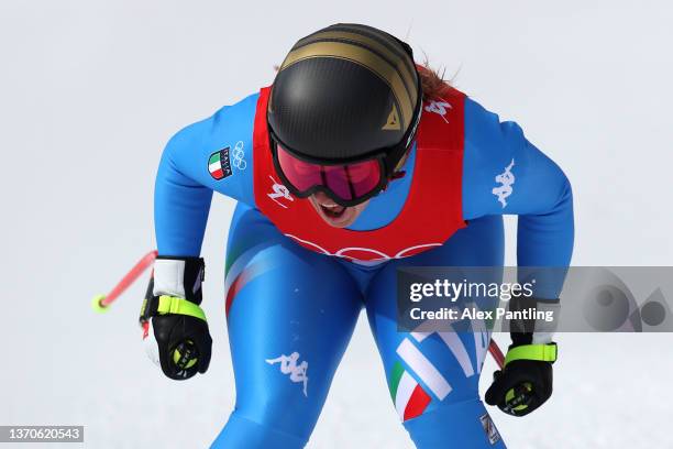 Sofia Goggia of Team Italy reacts following her run during the Women's Downhill on day 11 of the Beijing 2022 Winter Olympic Games at National Alpine...