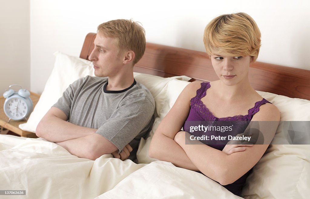 Couple after argument in bed