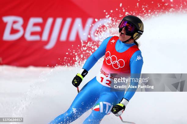 Sofia Goggia of Team Italy reacts following her run during the Women's Downhill on day 11 of the Beijing 2022 Winter Olympic Games at National Alpine...
