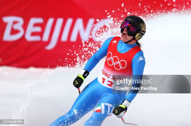 Sofia Goggia of Team Italy reacts following her run during the Women's Downhill on day 11 of the Beijing 2022 Winter Olympic Games at National Alpine...