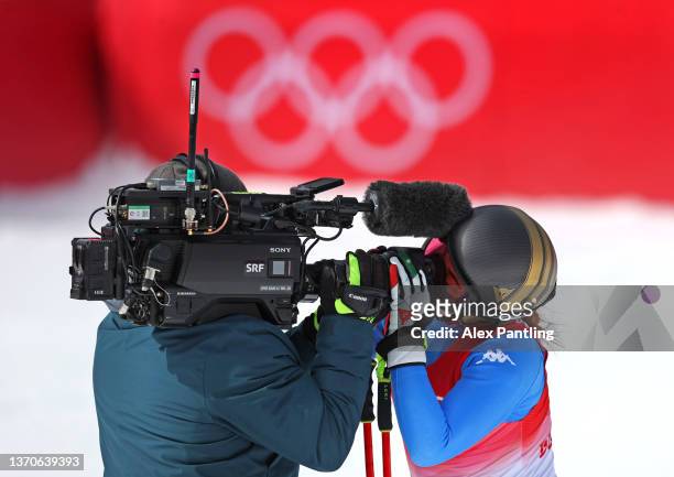 Sofia Goggia of Team Italy kisses a TV camera following her run during the Women's Downhill on day 11 of the Beijing 2022 Winter Olympic Games at...