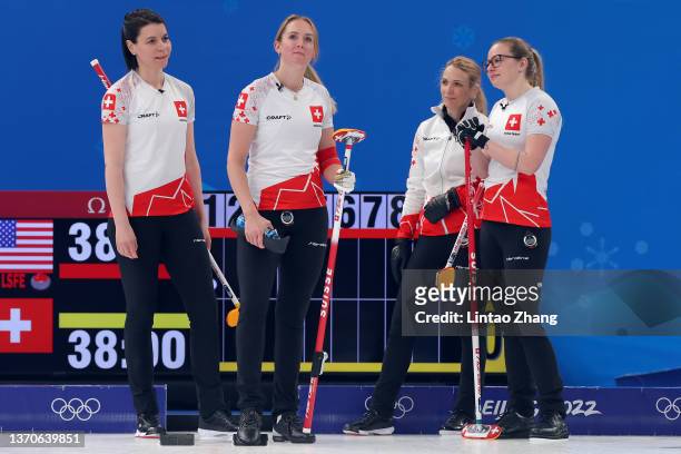 Esther Neuenschwander, Melanie Barbezat, Silvana Tirinzoni and Alina Paetz of Team Switzerland look on against Team United States during the Women’s...