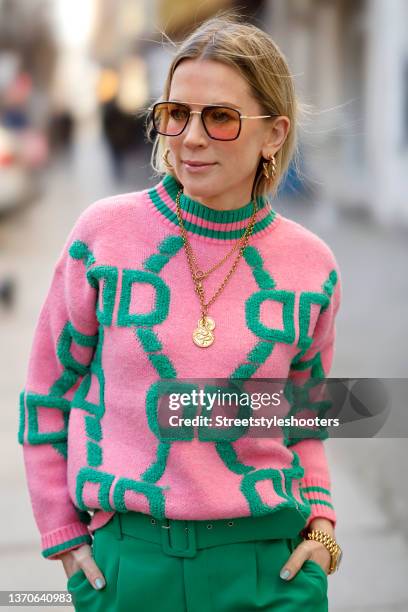 German TV host Tamara von Nayhauss wearing a pink and green pullover by Mooi, gold necklaces and gold earrings by Knocknok, green pants by Zara and...