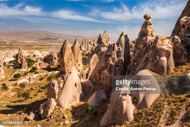 rock shapes near uchisar at sunrise, cappadocia, turkey - cappadocia stock pictures, royalty-free photos & images