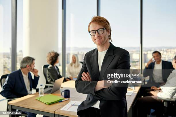 casual portrait of early 40s businessman in modern office - s ceo stock pictures, royalty-free photos & images