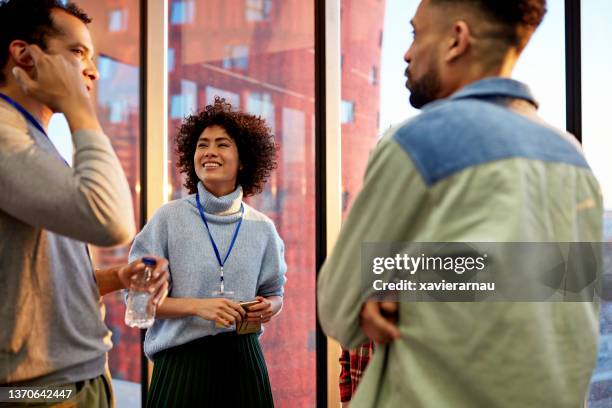 business associates in 20s and 30s enjoying social break - corporate casual clothing stock pictures, royalty-free photos & images