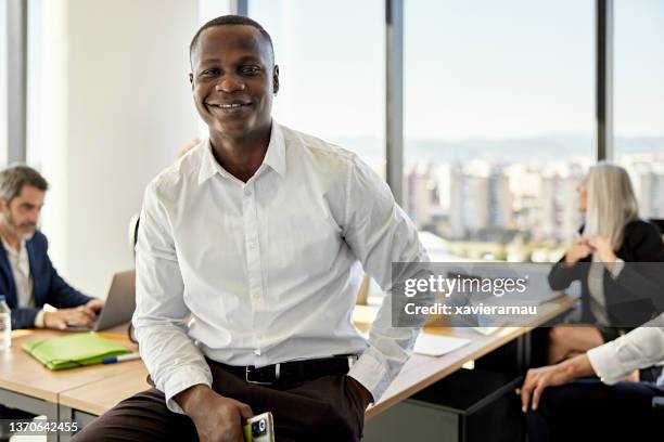 portrait of relaxed black businessman in meeting room - project manager stock pictures, royalty-free photos & images