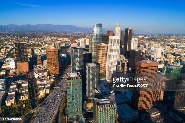 los angeles downtown skyline aerial with freeway - downtown los angeles aerial stock pictures, royalty-free photos & images