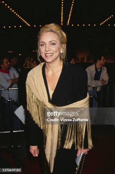 American actress and comedian Brett Butler, wearing a black outfit, wrapped in a gold shawl, attends the Century City premiere of 'Philadelphia,'...