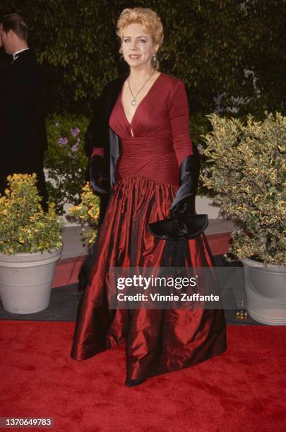 American actress and comedian Brett Butler, wearing a deep red evening gown, attends the 20th Annual People's Choice Awards, held at Sony Studios in...