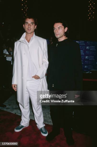 British singer, songwriter and guitarist Gavin Rossdale and British drummer Robin Goodridge attend the 1999 MTV Video Music Awards, held at the...