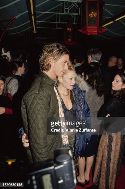 British singer, songwriter and guitarist Gavin Rossdale, wearing a green quilted jacket, and American singer Gwen Stefani, wearing a blue Tommy...