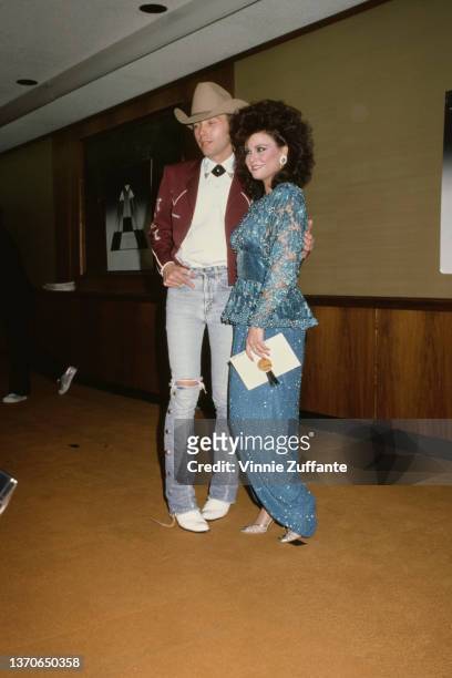 American singer-songwriter and guitarist Dwight Yoakam and American actress Delta Burke attend the 22nd Annual Academy of Country Music Awards, held...