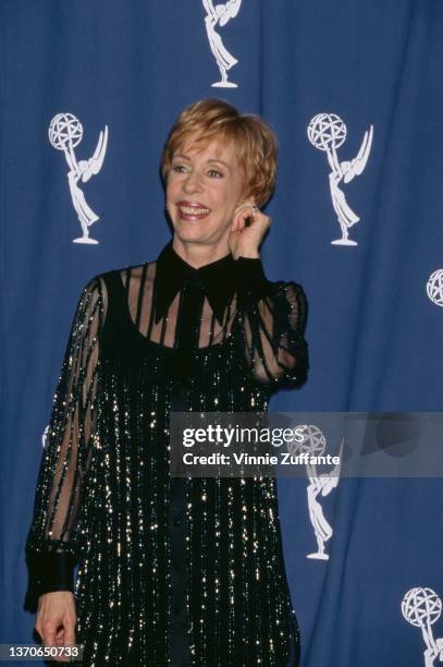 American comedian and actress Carol Burnett pulling her left ear in the press room of the 48th Primetime Emmy Awards, held at the Pasadena Civic...