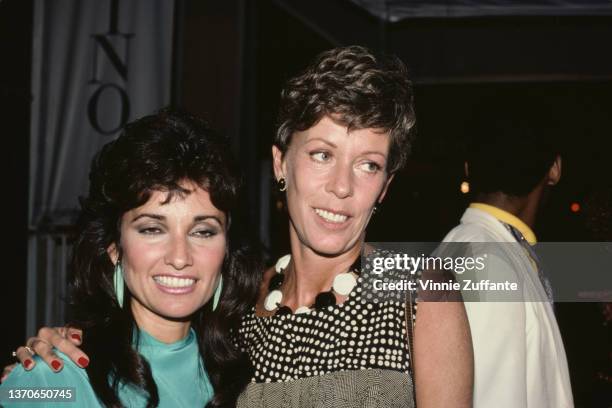 American actress Susan Lucci and American comedian and actress Carol Burnett, both 'All My Children' cast members, July 1982. Their fellow cast...