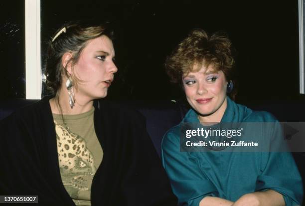 Maria Burton and American actress Donna Pescow attend an event, United States, circa 1990. Also known as Maria Taylor Burton, Burton is the adopted...