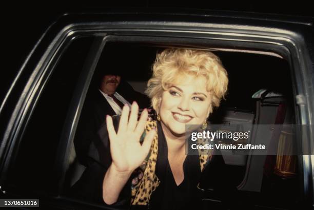 American actress Delta Burke waving from her car as she attends the ABC Affiliates Party, held at the Century Plaza Hotel in Los Angeles, California,...