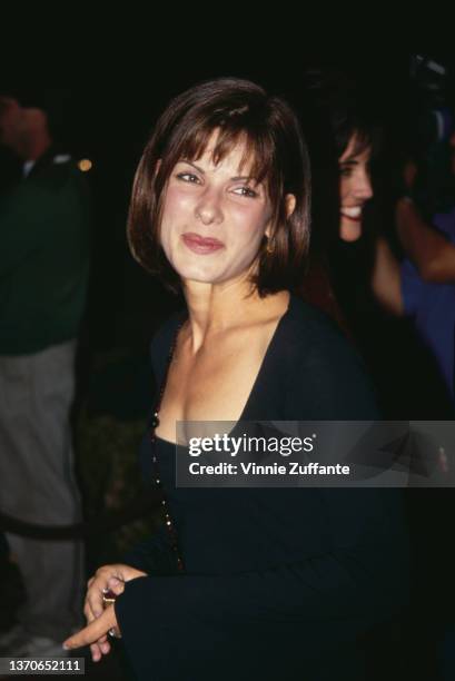 American actress Sandra Bullock attends the Westwood premiere of 'Demolition Man,' held at the Mann Village Theater in Los Angeles, California, 7th...