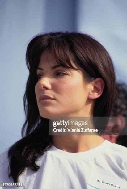 American actress Sandra Bullock, wearing a white t-shirt with a nametag, attends the AIDS Walk, a walkathon organised by AIDS Project Los Angeles ,...