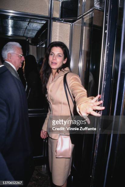 American actress Sandra Bullock attends the 1996 National Association of Theatre Owners ShoWest Convention, held at Bally's Hotel & Casino in Las...