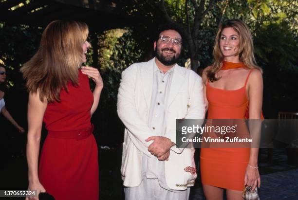 American actress Sandra Bullock, American film producer Joel Silver, and American fashion model Cindy Crawford attend the 1995 MTV Movie Awards, held...