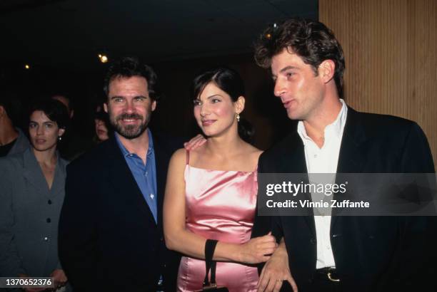 American actor and comedian Dennis Miller, American actress Sandra Bullock, and British actor Jeremy Northam attend the Beverly Hills premiere of...