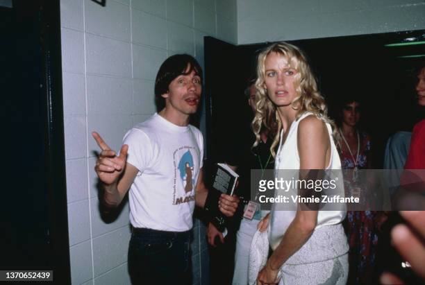 American singer-songwriter and musician Jackson Browne and American actress Daryl Hannah backstage at an date on the 'A Conspiracy of Hope' tour to...