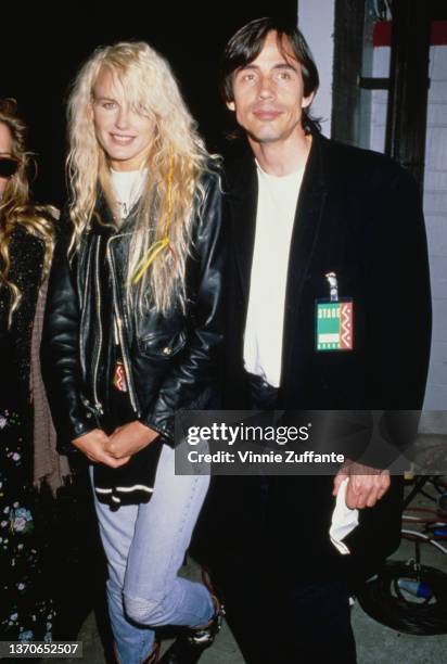 American actress Daryl Hannah and American singer-songwriter and musician Jackson Browne backstage at the Nelson Mandela 70th birthday tribute...