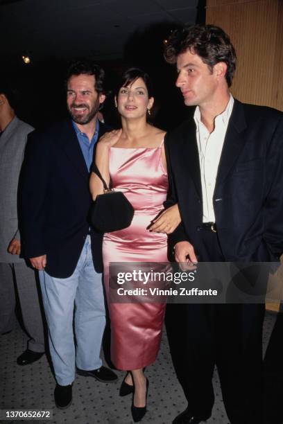 American actor and comedian Dennis Miller, American actress Sandra Bullock, and British actor Jeremy Northam attend the Beverly Hills premiere of...