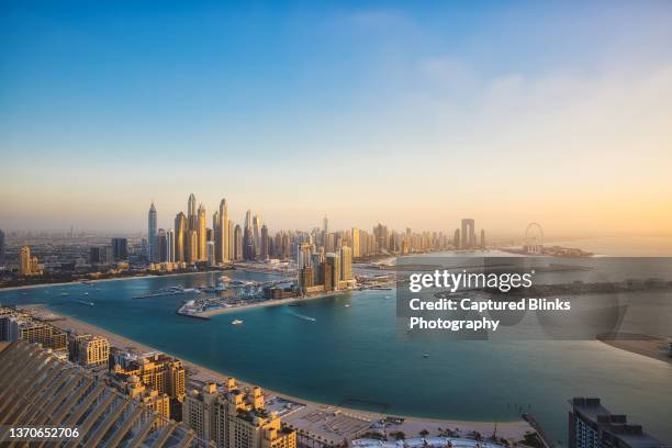 sunset view of dubai marina skyline during sunset - dubai city stock-fotos und bilder