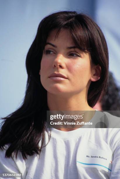 American actress Sandra Bullock, wearing a white t-shirt with a nametag, attends the AIDS Walk, a walkathon organised by AIDS Project Los Angeles ,...