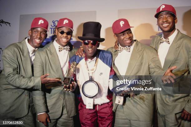 American R&B group Boyz II Men and American rapper Flavor Flav in the press room of the 6th Annual Soul Train Music Awards, held at the Shrine...