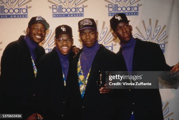 American R&B group Boyz II Men attend the 2nd Annual Billboard Music Awards, held at the Barker Hangar, Santa Monica Air Center in Santa Monica,...