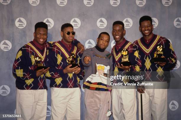 American R&B group Boyz II Men and American singer and producer Michael Bivins , of New Edition, in the press room of the 34th Annual Grammy Awards,...