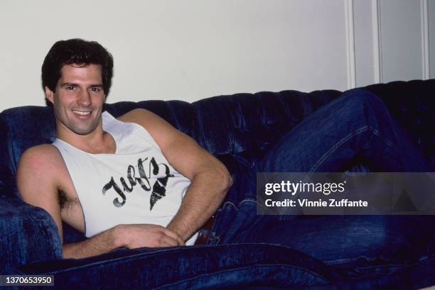 America model Scott Brown, wearing a white Tufts singlet and jeans, the winner of Cosmopolitan magazine's 'America's Sexiest Man' competition,...