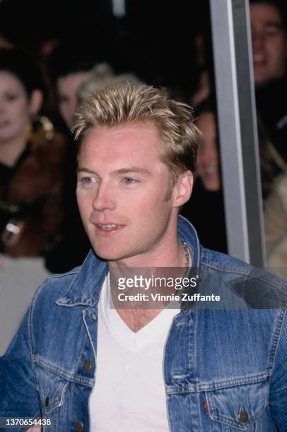 Irish singer and songwriter Ronan Keating, wearing a white t-shirt beneath a denim jacket, attends the 2000 MTV Europe Music Awards, held at the...