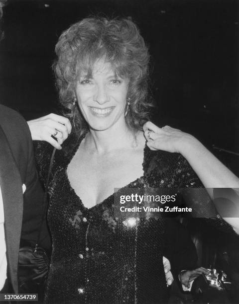 American actress Betty Buckley adjusts her sequin outfit as she attends the 37th Annual Tony Awards, held at the Uris Theater in New York City, New...