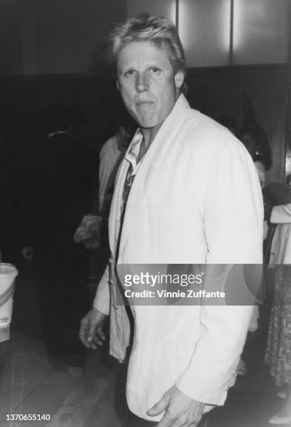 American actor Gary Busey, wearing a white jacket, in Los Angeles, California, circa 1987.