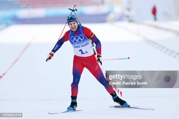 Vetle Sjaastad Christiansen of Team Norway celebrates after crossing the finish line to win the gold medal during Men's Biathlon 4x7.5km Relay on Day...