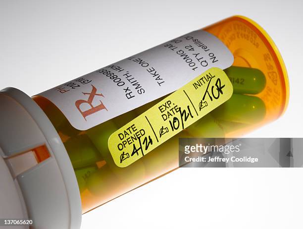 prescription bottle with warning label - best before stock pictures, royalty-free photos & images