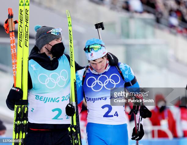 Eduard Latypov of Team ROC looks dejected while being consoled by teammate Alexander Loginov after winning the bronze medal during Men's Biathlon...