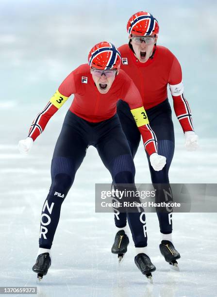 Hallgeir Engebraaten and Peder Kongshaug of Team Norway celebrate as they cross the finish line to win the Gold medal during the Men's Team Pursuit...