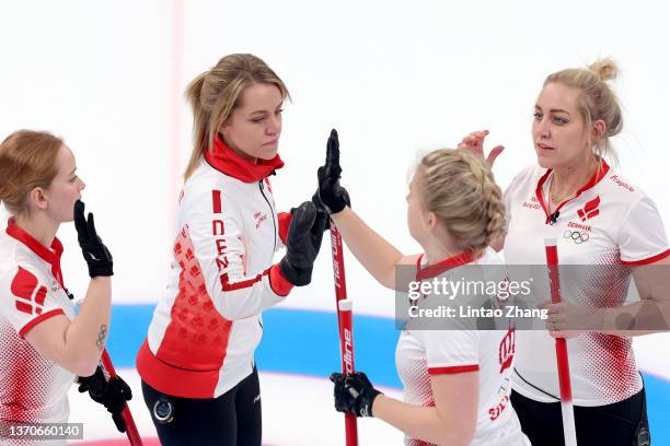 Mathilde Halse, Madeleine Dupont, My Larsen and Denise Dupont of Team Denmark react against Team Sweden during the Women’s Curling Round Robin...