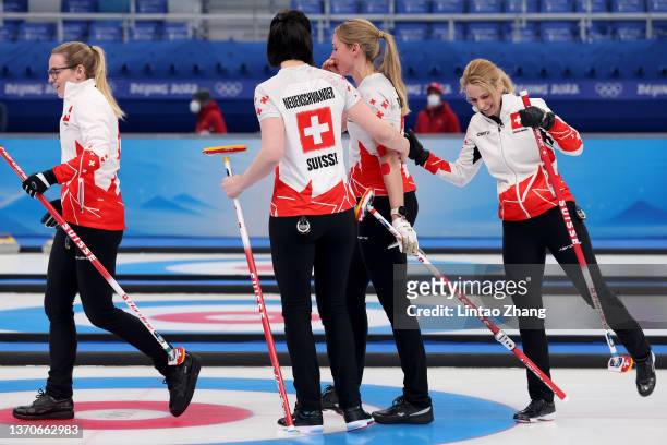 Alina Paetz, Esther Neuenschwander, Melanie Barbezat and Silvana Tirinzoni of Team Switzerland celebrate their victory against Team United States...
