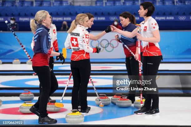 Esther Neuenschwander and Silvana Tirinzoni of Team Switzerland are congratulated on their victory against Team United States during the Women’s...