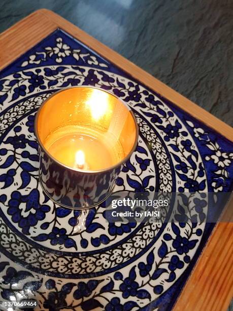 light of the ner zikaron / ner neshama, a 25 hours yahrzeit candle in memory of the deceased person - holocaust remembrance day stock pictures, royalty-free photos & images