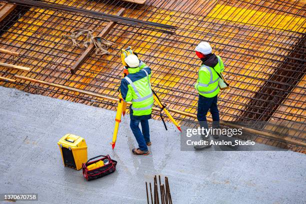 surveyors at the construction site - geodetisk kupol bildbanksfoton och bilder