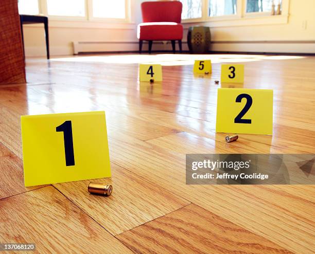 bullet casings with evidence markers - bullets stock pictures, royalty-free photos & images