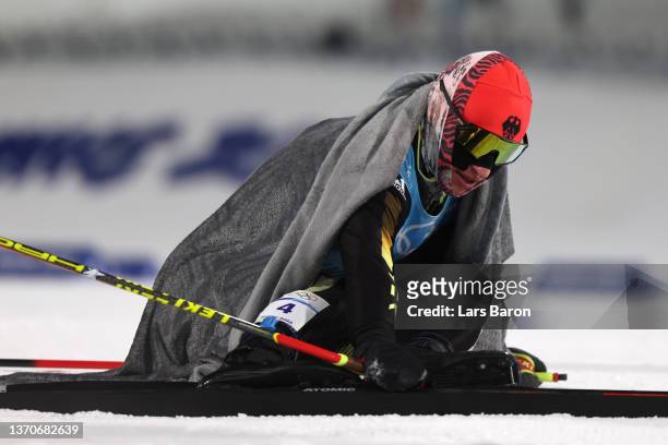 Manuel Faisst of Team Germany reacts following the Individual Gundersen Large Hill/10km, Cross Country Competition Round on day 11 of 2022 Beijing...